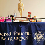 Sacred Patterns Acupuncture Table Display - Resonant Essentials Psychic Healing Fair - July 2024 - Albuquerque, NM