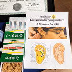 Sacred Patterns Acupuncture Table Display - Resonant Essentials Psychic Healing Fair - July 2024 - Albuquerque, NM