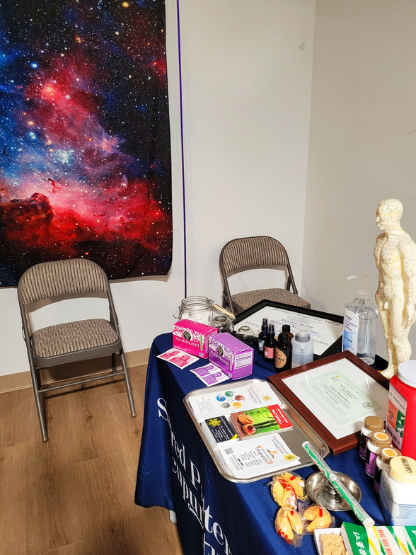 Sacred Patterns Acupuncture Table Display - Resonant Essentials Psychic Healing Fair - July 2024 - Albuquerque, NM